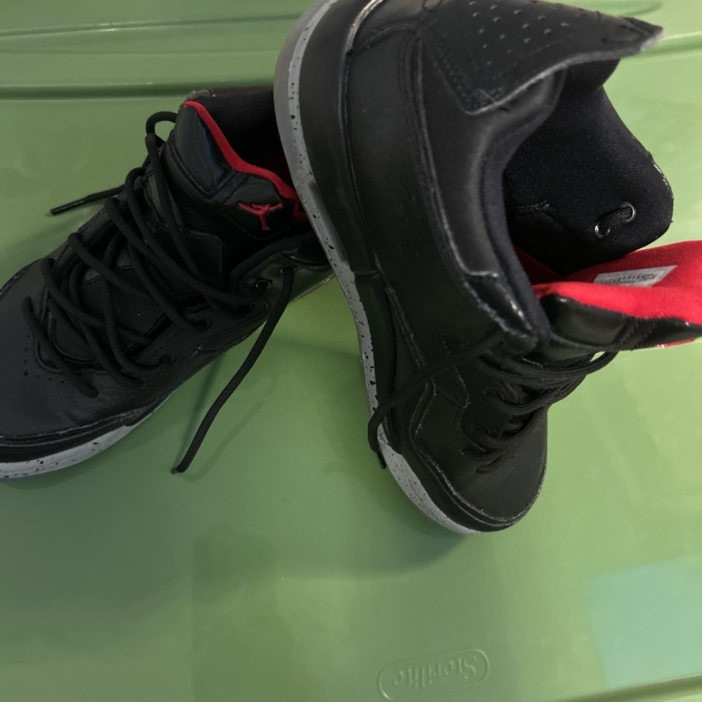 Kids Black and Red Jordan size 5.5